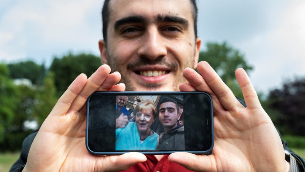O viață schimbată de un selfie cu Angela Merkel